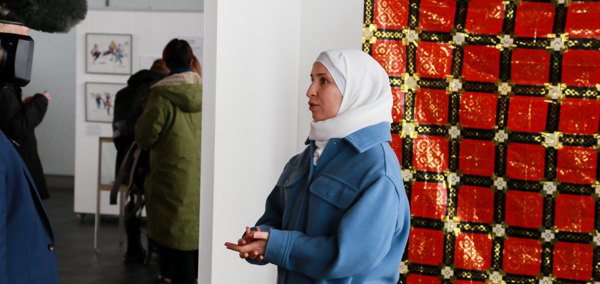 Image of Latifa Alnajjar: co-founder of the Syrian Dinner Project in Aberystwyth and co-creator of the Refugees from National Socialism exhibition, hosted by the Senedd.