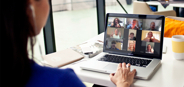 Person on a video call on a laptop with multiple people